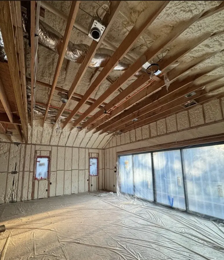 Interior walls and ceiling insulated with spray foam during new construction in Derry